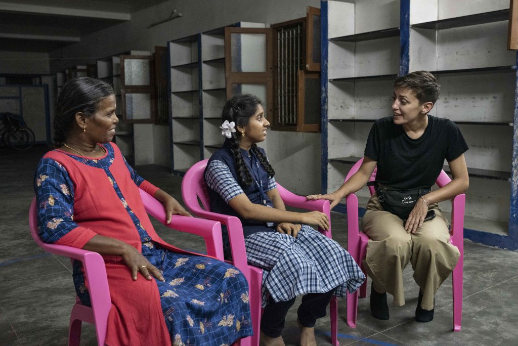 Dharani from the Distance Child Sponsorship programme talking with Energia Volunteer Malvina and home manager Thangam