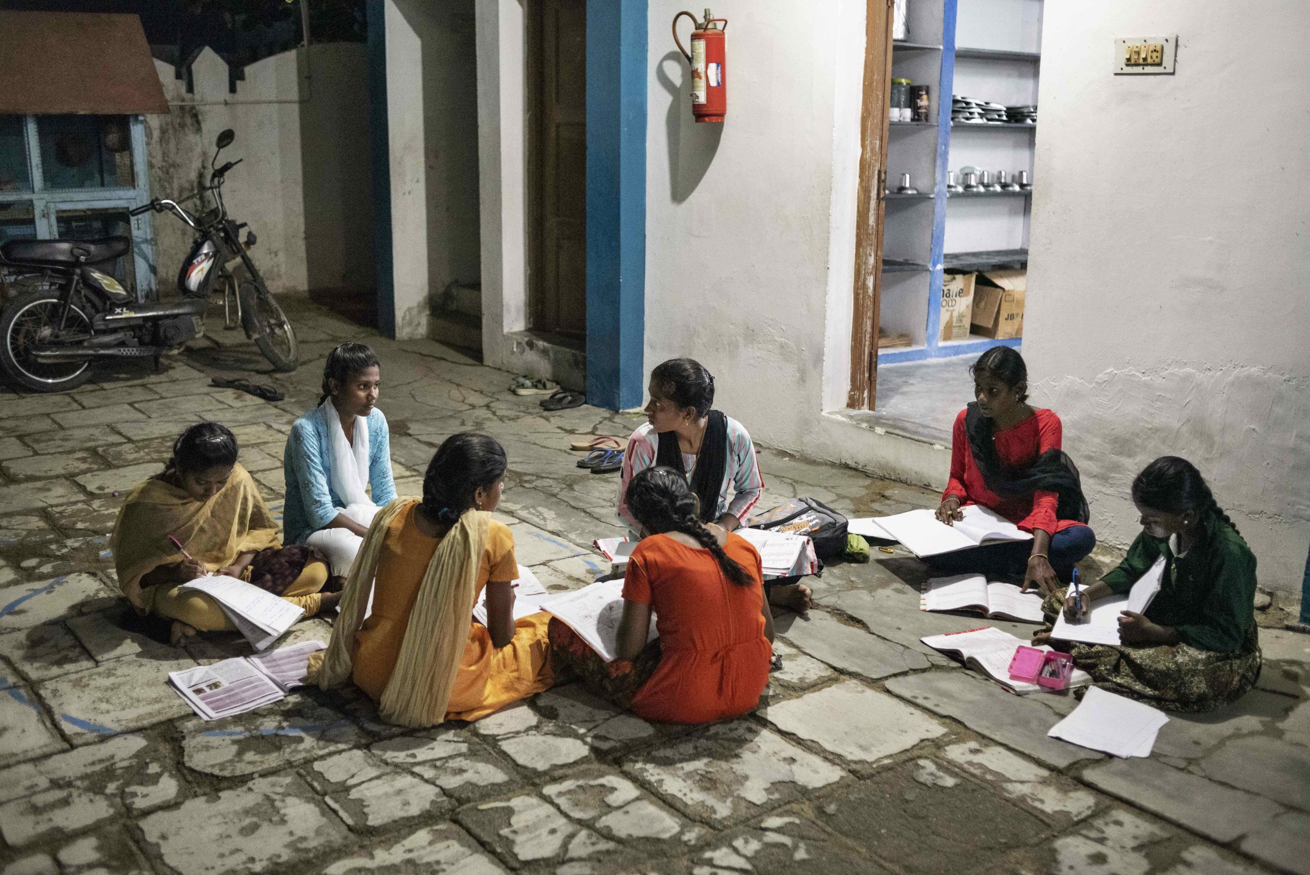 Island of Hope girls studying together