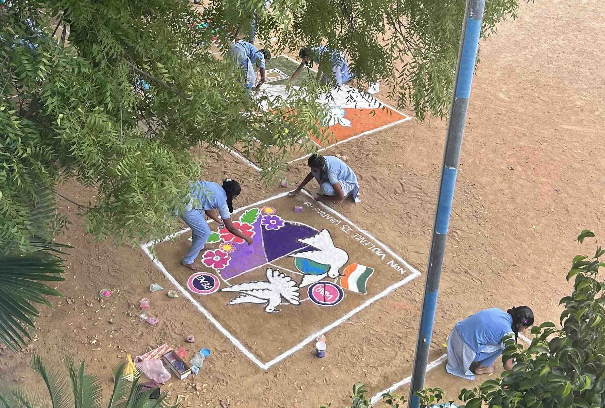 Rangoli drawn by students for International Non-Violence Day