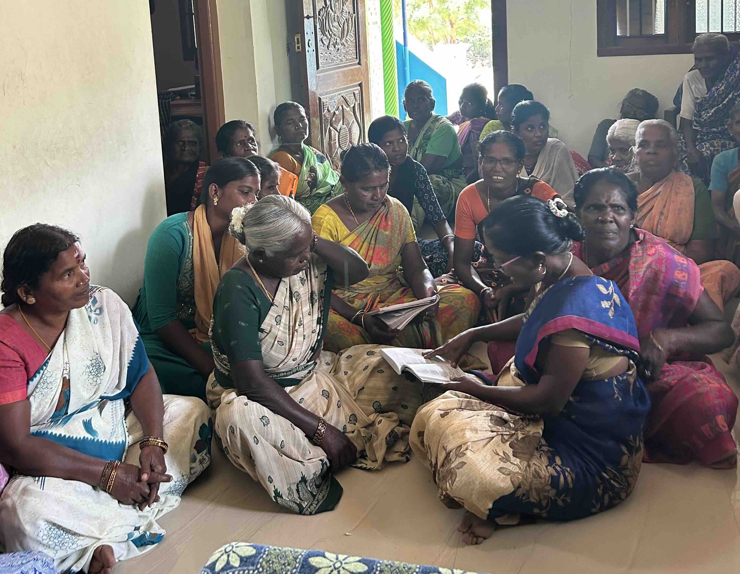 Reviewing a document together during the microcredit meeting