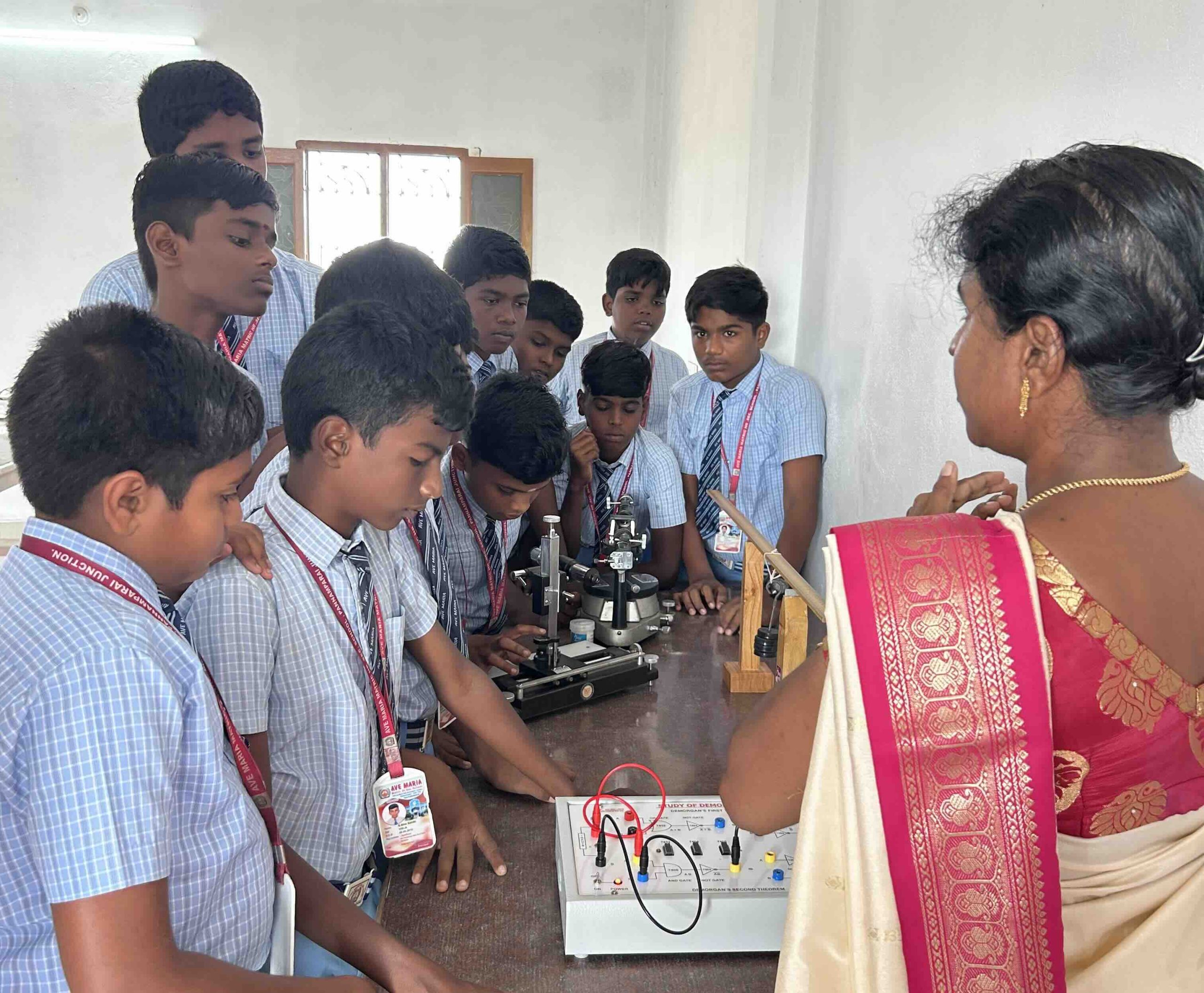Engaged students during a practical demonstration in the physics lab